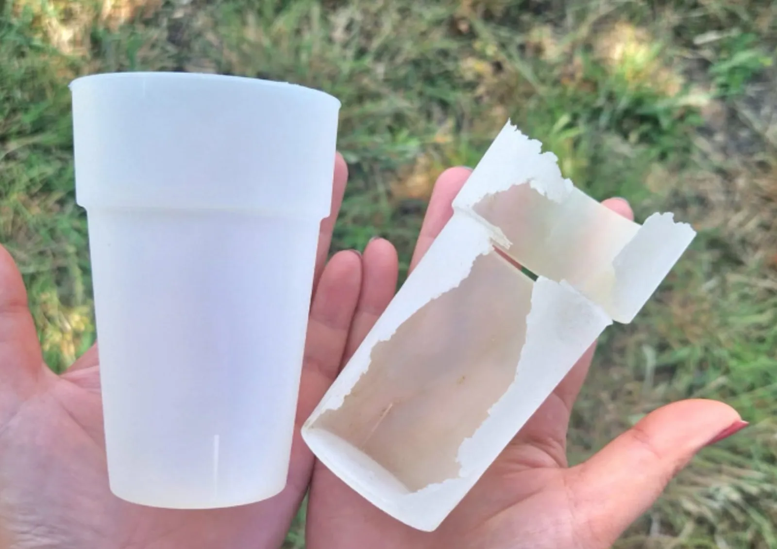 A PHA cup breaking apart in a person's hand, the material visibly softened and fragmenting